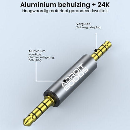 Grijze aluminium audiojack met 24K vergulde connectoren en merknaam Adroit Goods.