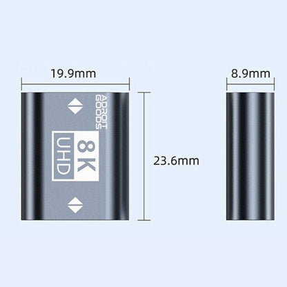 Compact zwart metalen apparaat met 8K UHD markering en afmetingen in millimeters weergegeven