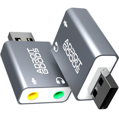 grijze usb geluidskaart met gele en groene audio poorten en witte tekst adroit goods