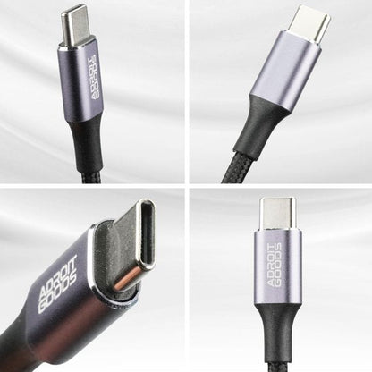 Close-up van een zilverkleurige USB-C-kabel met Adroit Goods-logo en gevlochten hoes.
