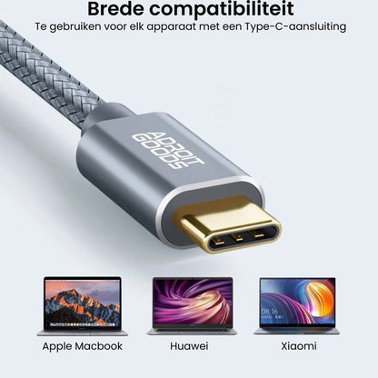 Close-up van een metalen Type-C-kabelconnector met geweven kabel en compatibele laptops.